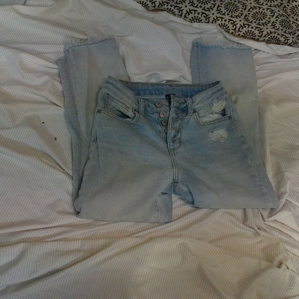 high waist ripped bottom jeans
